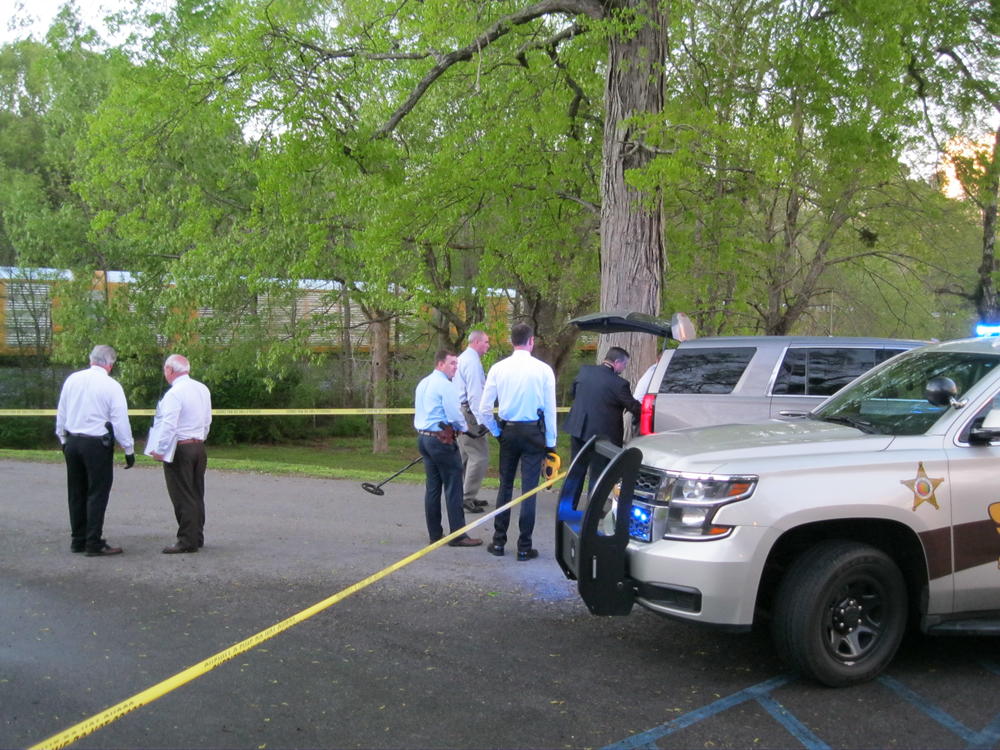 Officers Hunting Evidence at Crime Scene